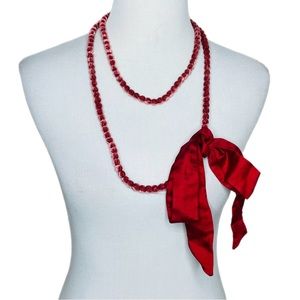 Noonday red  velvet covered beaded necklace with bow